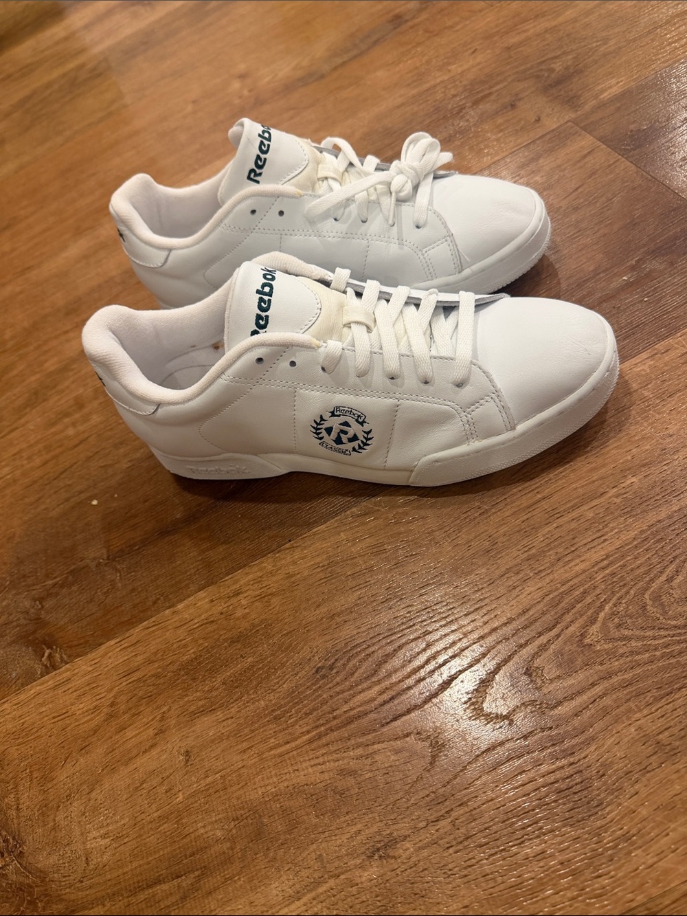Size 10  men’s sneakers White Low-Top Sneakers with Navy Logo